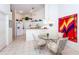 Open kitchen with a breakfast bar and white cabinetry at 4195 Fairway Pl, North Port, FL 34287