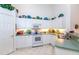 White kitchen with stainless steel appliances and an adjacent pantry at 4195 Fairway Pl, North Port, FL 34287