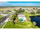 Community pool with surrounding landscaping and homes at 4195 Fairway Pl, North Port, FL 34287