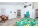 Bedroom with a double bed, dresser, and view into adjacent living space at 4195 Fairway Pl, North Port, FL 34287