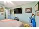Bedroom with a double bed and golf bag at 2480 Alamander Ave, Englewood, FL 34223