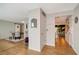 Home hallway with views into the dining room and living areas at 2480 Alamander Ave, Englewood, FL 34223