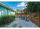 Small patio with seating area next to home at 2480 Alamander Ave, Englewood, FL 34223