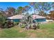 Single-story home with a large backyard, and ocean views at 2480 Alamander Ave, Englewood, FL 34223