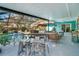 Relaxing poolside patio with seating and outdoor dining at 2480 Alamander Ave, Englewood, FL 34223