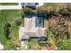 Aerial view showing house, pool, and lush landscaping at 2480 Alamander Ave, Englewood, FL 34223