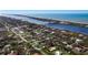 Aerial view of homes and properties situated by the water at 2480 Alamander Ave, Englewood, FL 34223