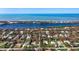 Aerial view of a residential neighborhood near the water at 2480 Alamander Ave, Englewood, FL 34223