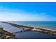 Coastal aerial view showcasing waterfront property and bridge at 2480 Alamander Ave, Englewood, FL 34223