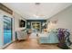 Living room with sectional sofa and access to pool at 2480 Alamander Ave, Englewood, FL 34223