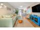 Open living room with a view of the kitchen and access to the backyard at 2480 Alamander Ave, Englewood, FL 34223