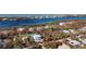 Aerial view showcasing a home and neighborhood by the water at 2480 Alamander Ave, Englewood, FL 34223