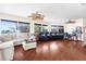Gathering room with hardwood floors, sectional sofa, and large windows at 4024 Casey Key Rd, Nokomis, FL 34275