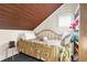 Cozy bedroom with wood-paneled ceilings and a comfortable bed at 4024 Casey Key Rd, Nokomis, FL 34275
