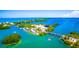 Aerial perspective of a tropical island with a bridge and marina at 4024 Casey Key Rd, Nokomis, FL 34275