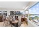 Breakfast bar with glass top and wrought iron chairs, offering a water view at 4024 Casey Key Rd, Nokomis, FL 34275