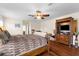 Main bedroom with king-size bed and hardwood floors at 4024 Casey Key Rd, Nokomis, FL 34275