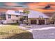 Two-story home with metal roof and stone accents at 4024 Casey Key Rd, Nokomis, FL 34275