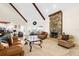 Bright living room features a stone fireplace and comfortable seating at 4024 Casey Key Rd, Nokomis, FL 34275