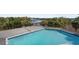 Relaxing pool deck overlooking the water with a large pool at 4024 Casey Key Rd, Nokomis, FL 34275