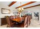 Elegant dining room featuring a large wood table and chandelier at 4024 Casey Key Rd, Nokomis, FL 34275