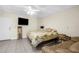 Bright bedroom featuring a large bed and sitting area at 4024 Casey Key Rd, Nokomis, FL 34275