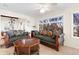 Comfortable living room with large windows and ample seating at 4024 Casey Key Rd, Nokomis, FL 34275