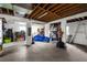 Unfinished basement area with storage and exercise equipment at 4024 Casey Key Rd, Nokomis, FL 34275