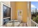 Outdoor balcony with a table and chairs, perfect for relaxing at 4024 Casey Key Rd, Nokomis, FL 34275