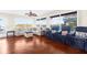 Gathering room featuring hardwood floors, sectional sofa and fireplace at 4024 Casey Key Rd, Nokomis, FL 34275