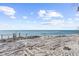 Sandy beachfront with tire tracks and ocean view at 4024 Casey Key Rd, Nokomis, FL 34275