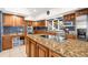 Spacious kitchen with island, granite counters and stainless steel appliances at 4024 Casey Key Rd, Nokomis, FL 34275