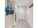 Inviting entryway with tile flooring and built-in shelving at 4024 Casey Key Rd, Nokomis, FL 34275