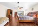 Spacious main bedroom with a king-size bed and hardwood floors at 4024 Casey Key Rd, Nokomis, FL 34275