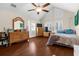 Spacious bedroom with hardwood floors, vaulted ceilings and private access to the backyard at 4024 Casey Key Rd, Nokomis, FL 34275