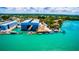 Aerial view of waterfront property with boat slips and restaurant at 4024 Casey Key Rd, Nokomis, FL 34275
