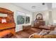 Sitting area with antique piano and hardwood floors at 4024 Casey Key Rd, Nokomis, FL 34275
