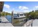 Wooden dock with a houseboat and mangrove trees at 4024 Casey Key Rd, Nokomis, FL 34275