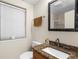 Simple bathroom with granite vanity, toilet, and shower at 4024 Casey Key Rd, Nokomis, FL 34275