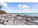 Rocky beachfront with sandy areas and ocean view at 4024 Casey Key Rd, Nokomis, FL 34275