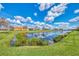 Serene lake view with abundant natural vegetation at 10780 Tarflower Dr # 101, Venice, FL 34293