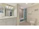 Clean bathroom with a bathtub, shower, and white vanity at 10780 Tarflower Dr # 101, Venice, FL 34293