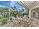 Spacious screened patio with seating area, perfect for outdoor dining at 5856 Wilson Rd, Venice, FL 34293