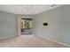 Bright bedroom with sliding glass doors leading to the patio at 5856 Wilson Rd, Venice, FL 34293