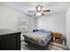 Cozy bedroom with a full-size bed and hardwood floors at 6738 Brentford Rd, Sarasota, FL 34241