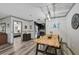 Eat in kitchen with modern light fixture and access to bedroom at 6738 Brentford Rd, Sarasota, FL 34241
