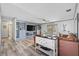 Spacious living room with built-in shelving and hardwood floors at 6738 Brentford Rd, Sarasota, FL 34241
