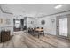 Modern dining area with a large wooden table and six chairs at 6738 Brentford Rd, Sarasota, FL 34241
