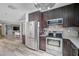 Modern kitchen with stainless steel appliances and a farmhouse sink at 6738 Brentford Rd, Sarasota, FL 34241
