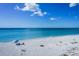 Tranquil beach scene with umbrella at 1622 Landfall Dr, Nokomis, FL 34275